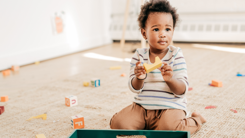 Picture of toddler playing with wooden blocks