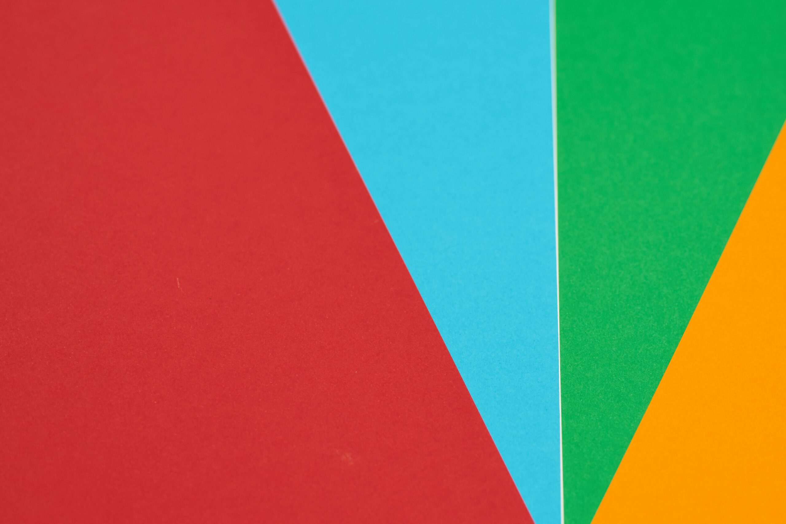 pexels-photo-1672322-1672322 Colorful abstract design featuring red, blue, green, and orange geometric shapes.